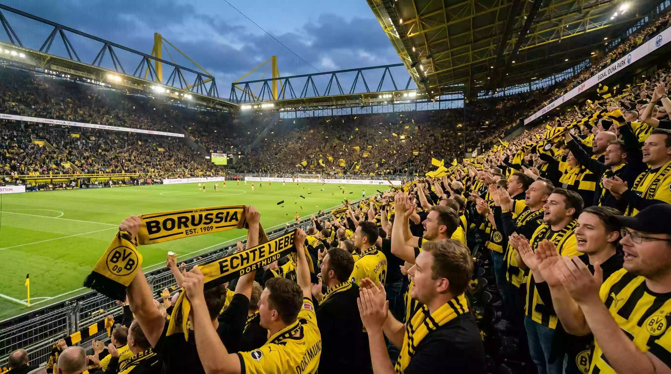 Aficionados de la Bundesliga celebrando un gol en un estadio lleno
